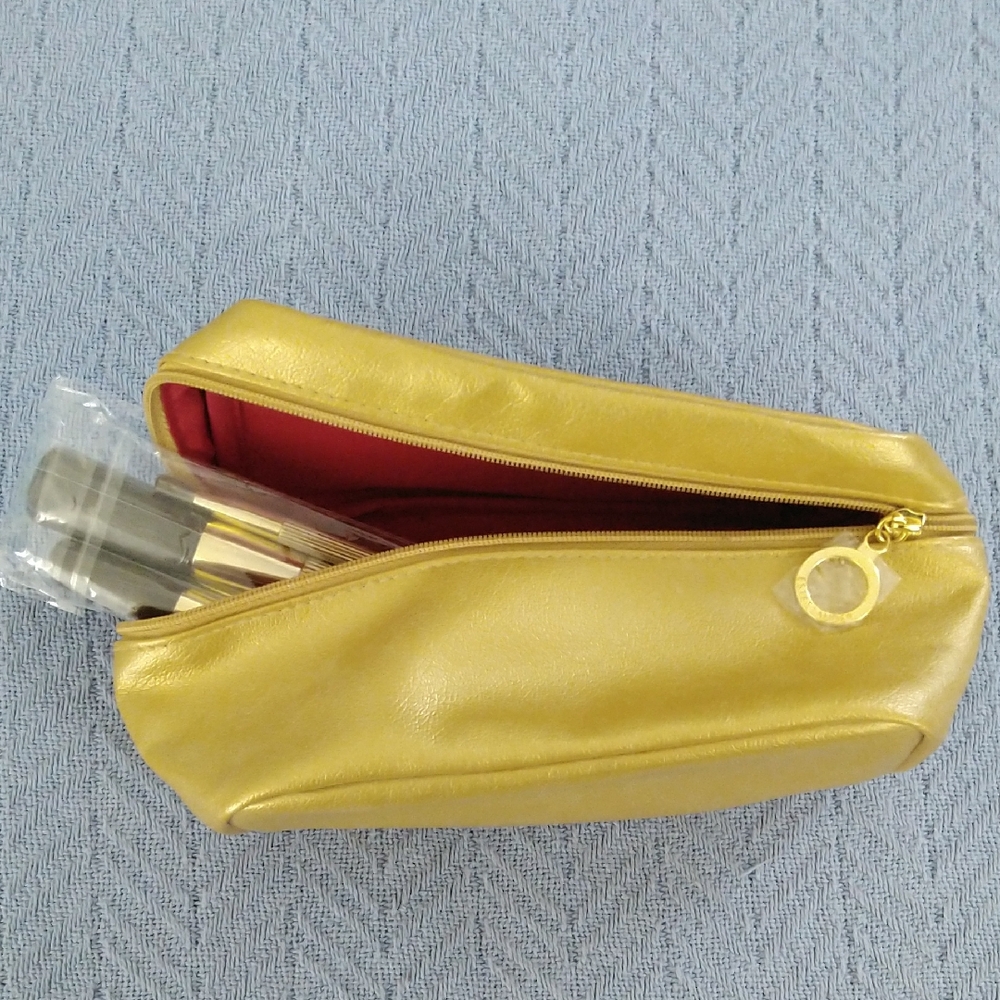 Estee Lauder cosmetic bag and brushes in gold. Unused!